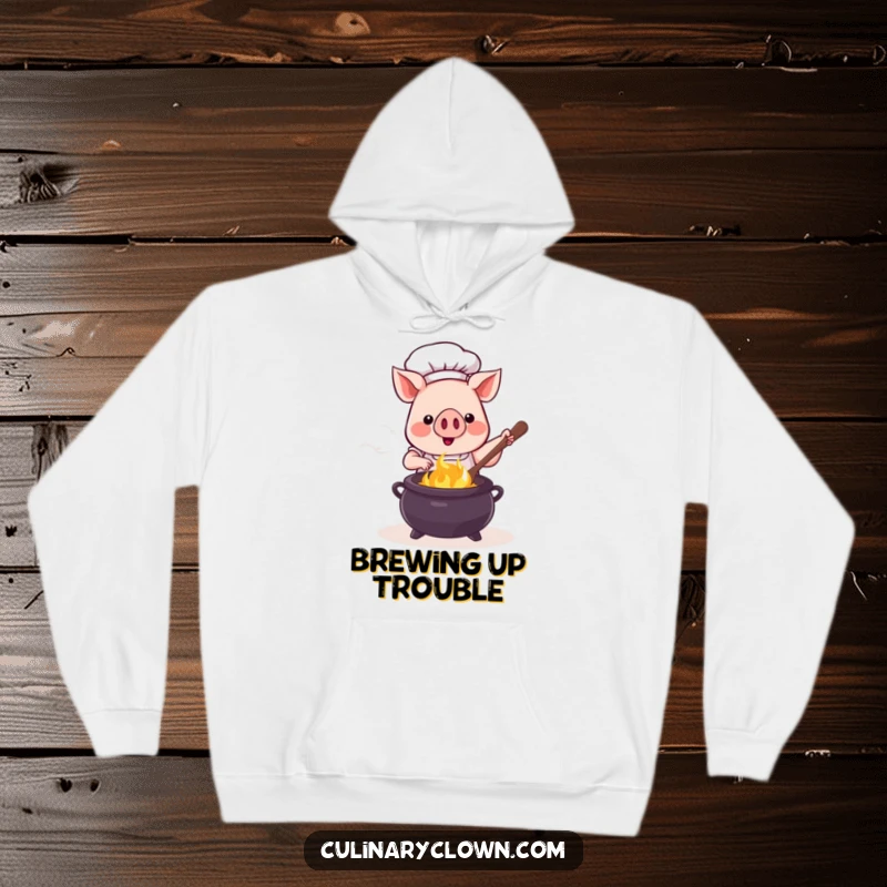 Funny kawaii pig chef stirring a bubbling cauldron, designed on a warm and comfy hoodie for ultimate coziness.
