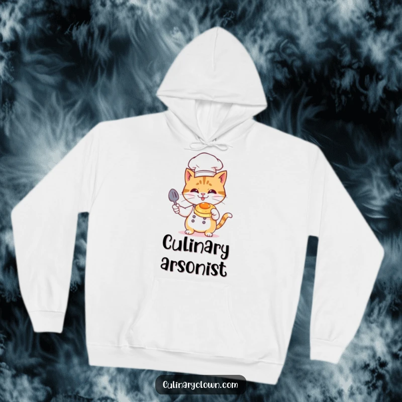 Funny Cat Chef Hoodie: A mischievous cat chef in toque flambéing a pancake, a hilarious culinary disaster.