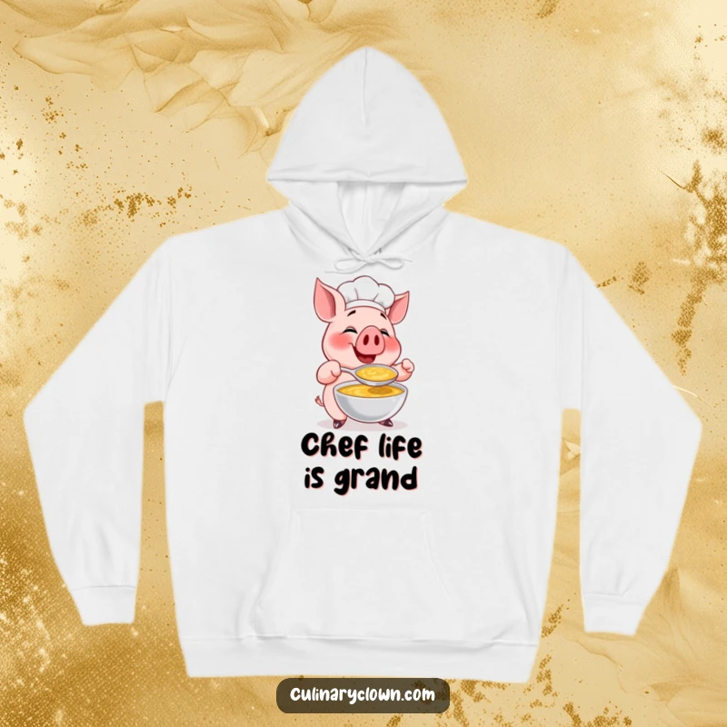 Funny hoodie featuring a happy pig chef character gleefully tasting a large spoonful of soup, designed for ultimate comfort and humor.