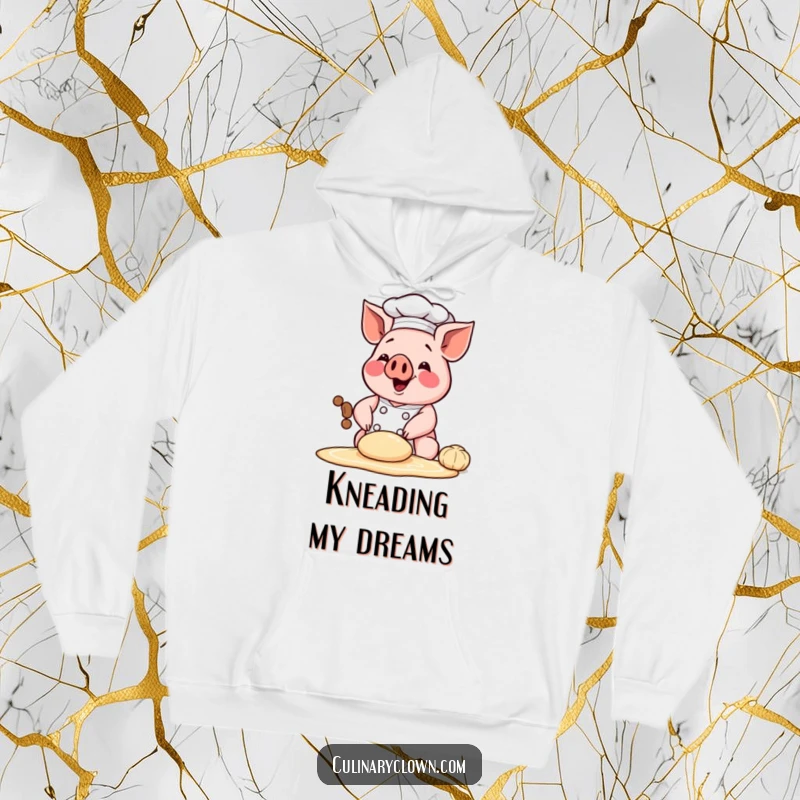 Funny hoodie featuring a happy chef pig character kneading dough, offering warmth and a humorous baking-themed design.