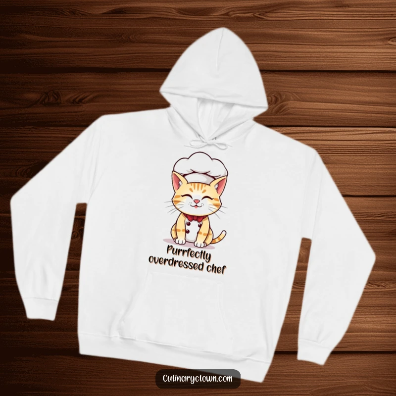 Funny hoodie showing a mischievous cat chef with an oversized chef hat, perfect for staying warm and stylish.