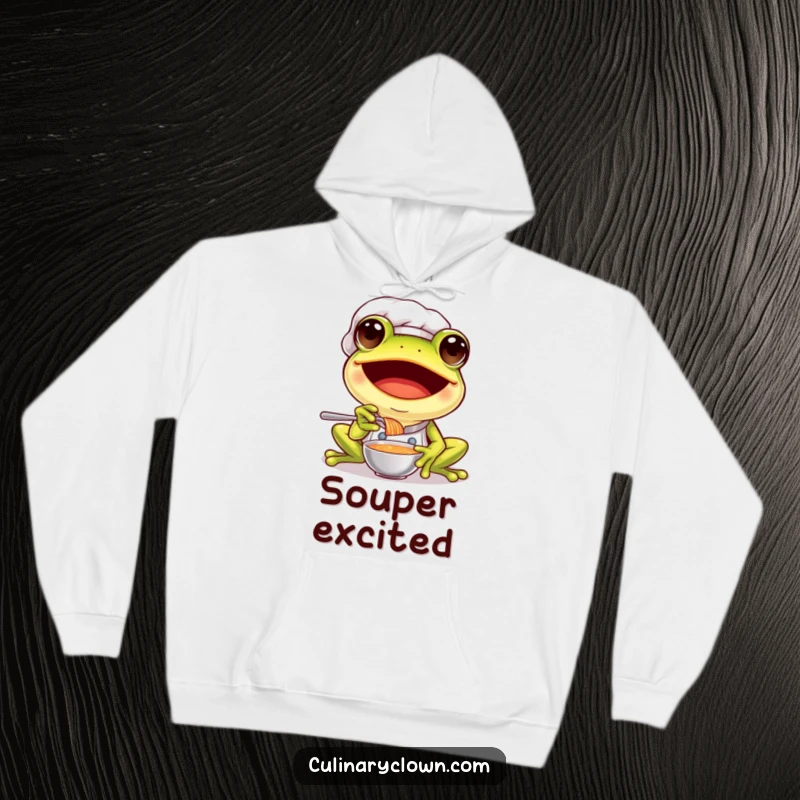 Funny frog chef hoodie design featuring a happy frog in a chef's hat, eagerly tasting a sample of soup with a big smile.