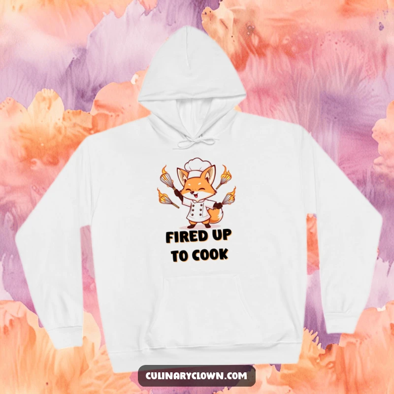 Funny hoodie featuring a determined fox chef intensely juggling flaming whisks, radiating heat and culinary prowess.
