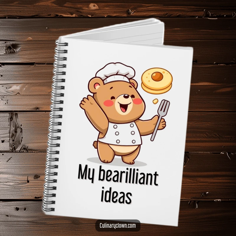 Funny notebook with a happy bear chef tossing a pancake in the air, perfect for jotting down breakfast recipes.