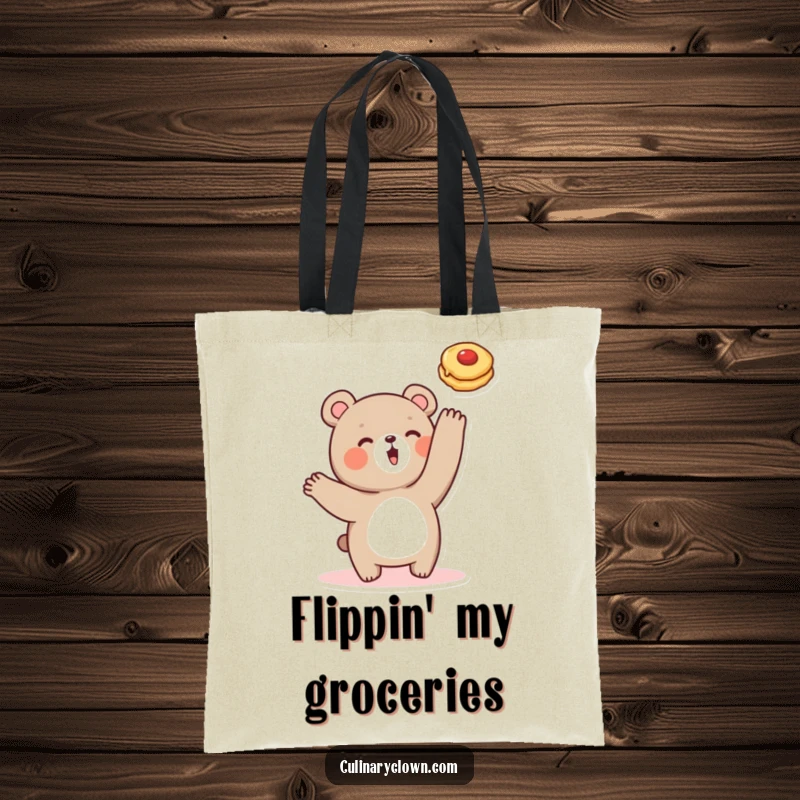 Funny tote bag showcasing a cute bear character mid-pancake flip, ideal for grocery runs and happy travels.